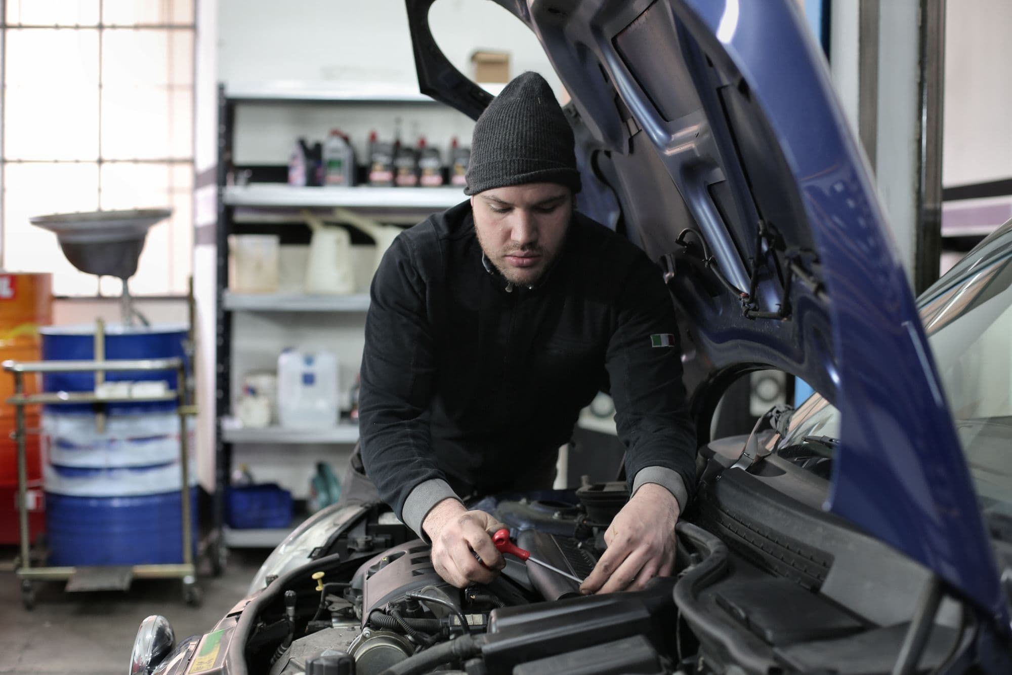 Mechanic inspecting an engine bay